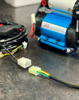 Switch Pros Quick Connect Harness for ARB Compressors connected to ARB compressor unit.