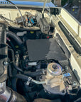 70 Series Landcruiser Blank Plate (2007-Current) mounted in engine bay for 12-volt system setup.