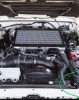 70 Series Landcruiser Battery Side Accessories Kit 2007-2023 install location under the hood with labeled components.