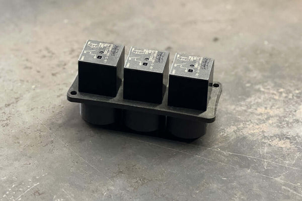 Flange mounted relay base