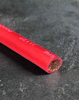 SGX Flex Battery Cable showing high-quality red insulation and copper core for optimal power delivery.
