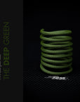 The Deep Green Braided Cable Sleeve displayed in a spiral on a dark background, showcasing its premium quality and unique color.