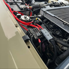 70 Series Landcruiser Blank Plate (2007-Current) electrical setup with red wiring and relay connections under the hood.