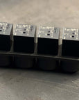 Next-Gen Mini Relay Base with four relays mounted on a durable base for professional installations.