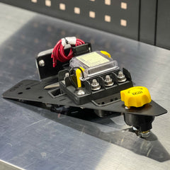 Electrical component with wires and connectors on a metallic surface