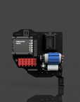 Technical component with red and blue elements on a reflective surface