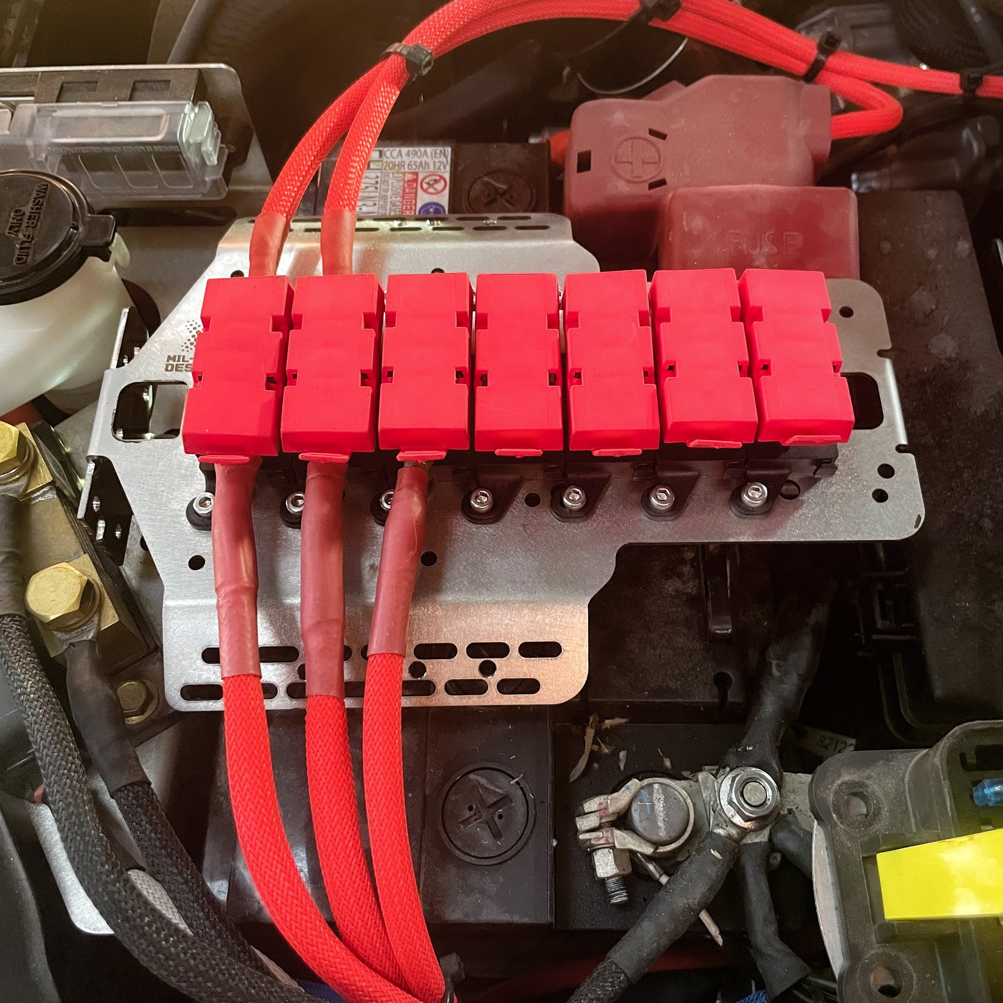N80 Hilux (2015-Current ) Battery Fuse Bracket Kit with seven MIDI fuse holders mounted in engine bay.