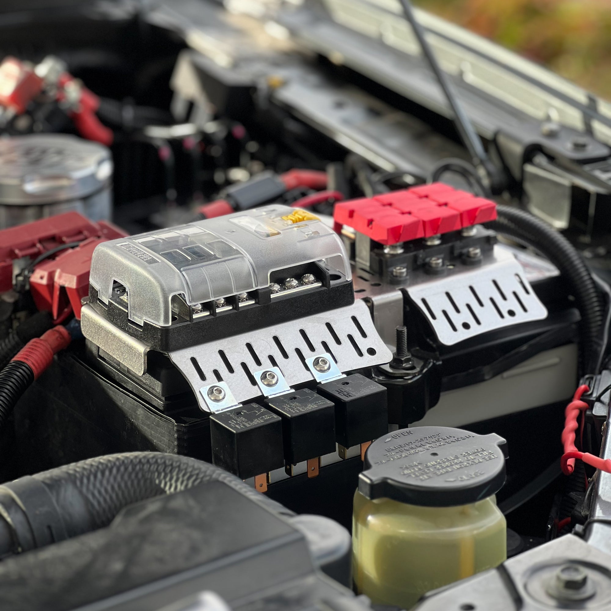 Navara NP300 Battery Fuse Bracket (2015-Current) installed in engine bay for optimal electrical management.