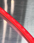 SGX Flex Battery Cable showing high-performance red insulation and specifications on a metallic background.