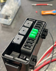 Toyota Accessory Fuse Box Insert Kit with relays and mini fuses for powering accessories.