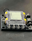 Blue Sea Safety-Hub 150 Fuse Block on a black surface with clear cover and terminals.