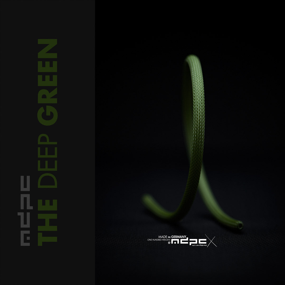 The Deep Green Braided Cable Sleeve showcased on a dark background, highlighting its unique texture and deep green color.