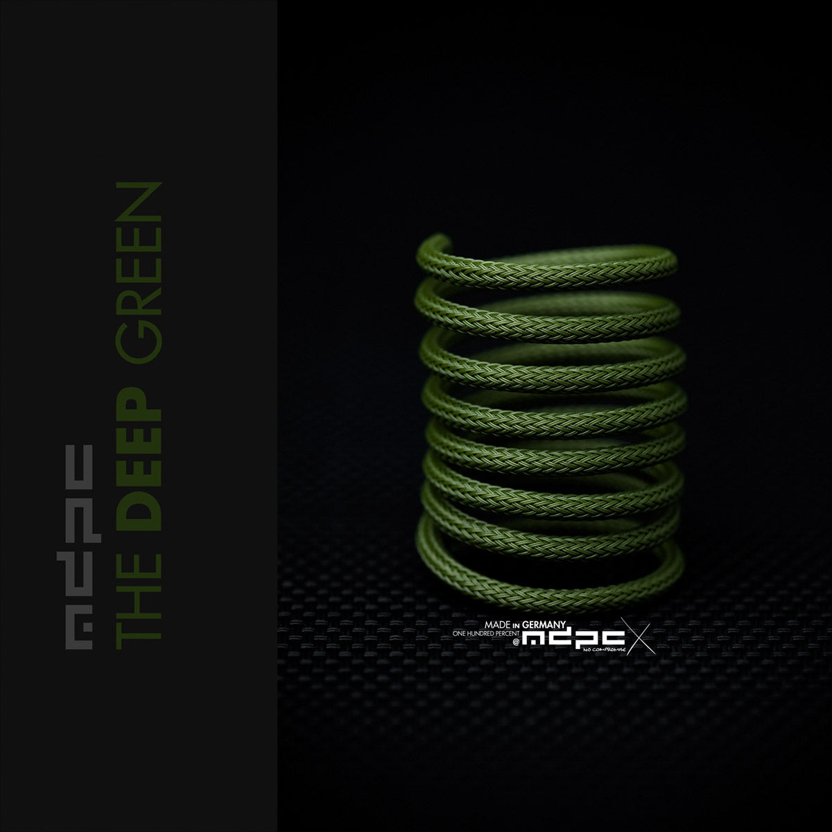 The Deep Green Braided Cable Sleeve displayed in a spiral on a dark background, showcasing its premium quality and unique color.