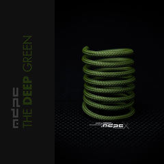 The Deep Green Braided Cable Sleeve displayed in a spiral on a dark background, showcasing its premium quality and unique color.