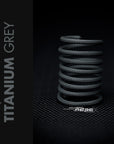 Titanium Grey Braided Cable Sleeve coiled, showcasing its unique medium grey shade for PC builds.