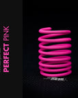 Perfect Pink Braided Cable Sleeve coiled in a unique design, showcasing its vibrant color and high-quality material.