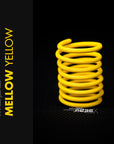Mellow Yellow Braided Cable Sleeve displayed in a spiral arrangement, showcasing its vibrant color and braided design.